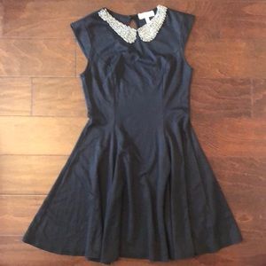 Women’s black dress with beautiful neck detail